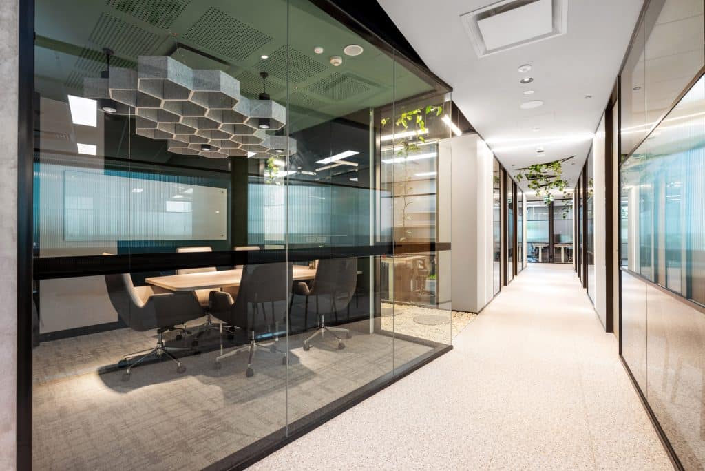 a clear all glass meeting room