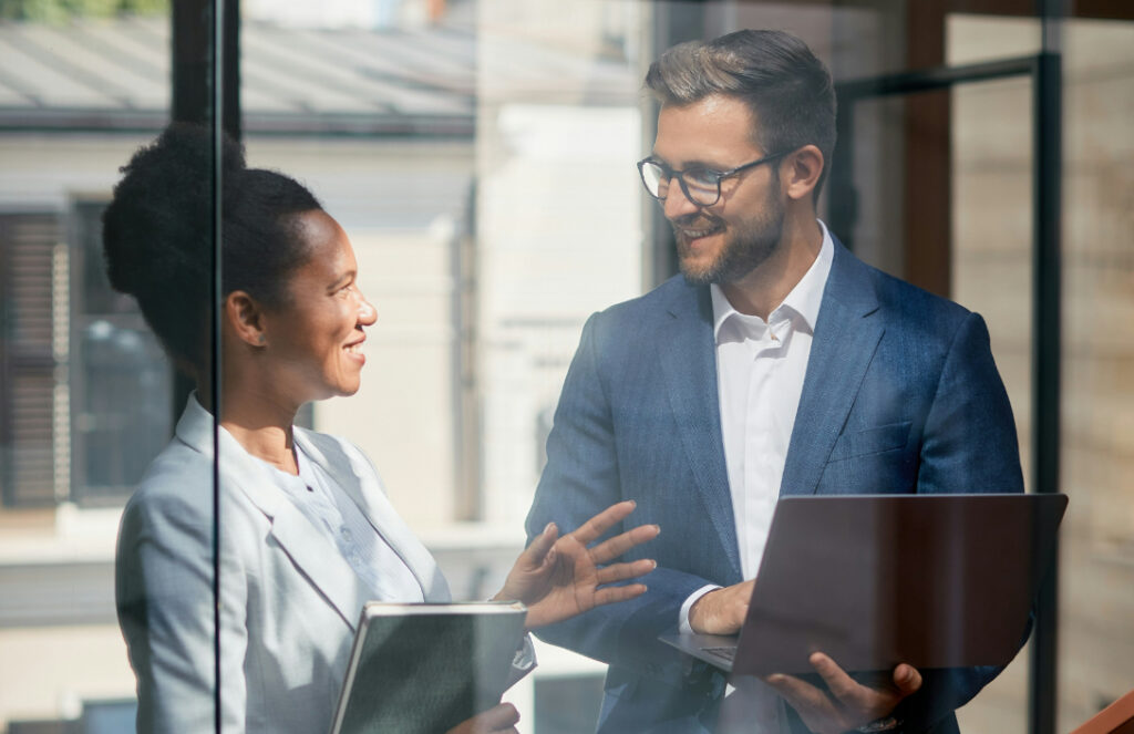 Two coworkers talking in their serviced office space