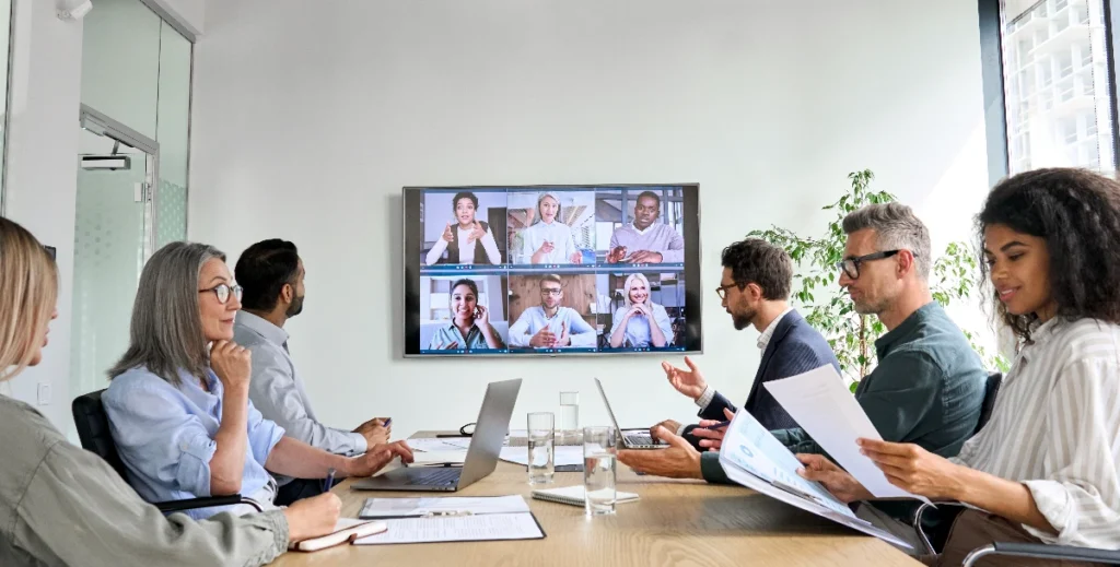 Business team in a hybrid meeting room setup